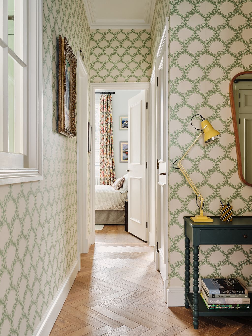 Wallpapered hallway with architectural trim